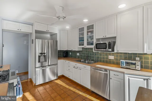 a view of balcony with wooden floor and outdoor seating