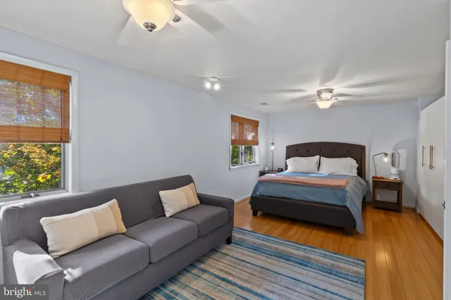 a bedroom with bed and window