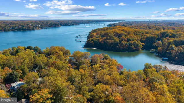 an aerial view of a houses with ocean view