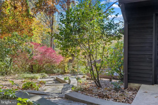 a view of a house with brick walls