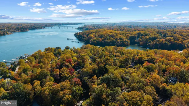 a view of a patio with table and chairs with wooden floor and fence