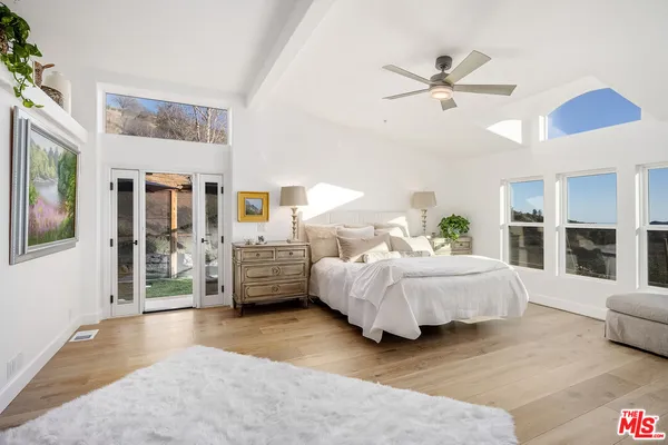 a bed room with a bed and a window