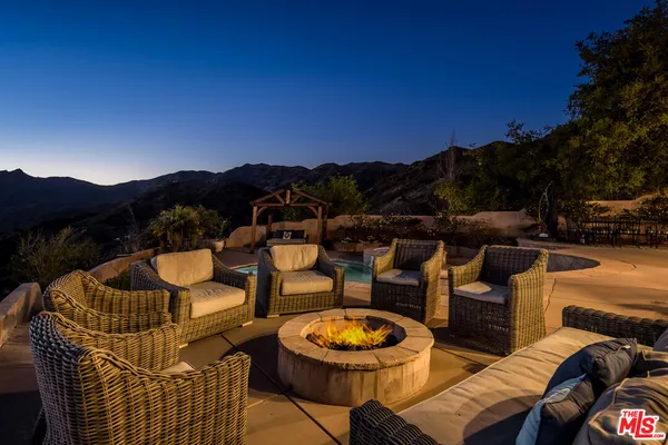 a view of a terrace with furniture