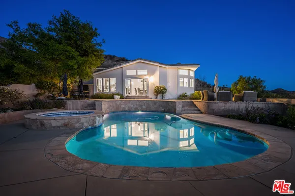 a view of a house with a yard balcony
