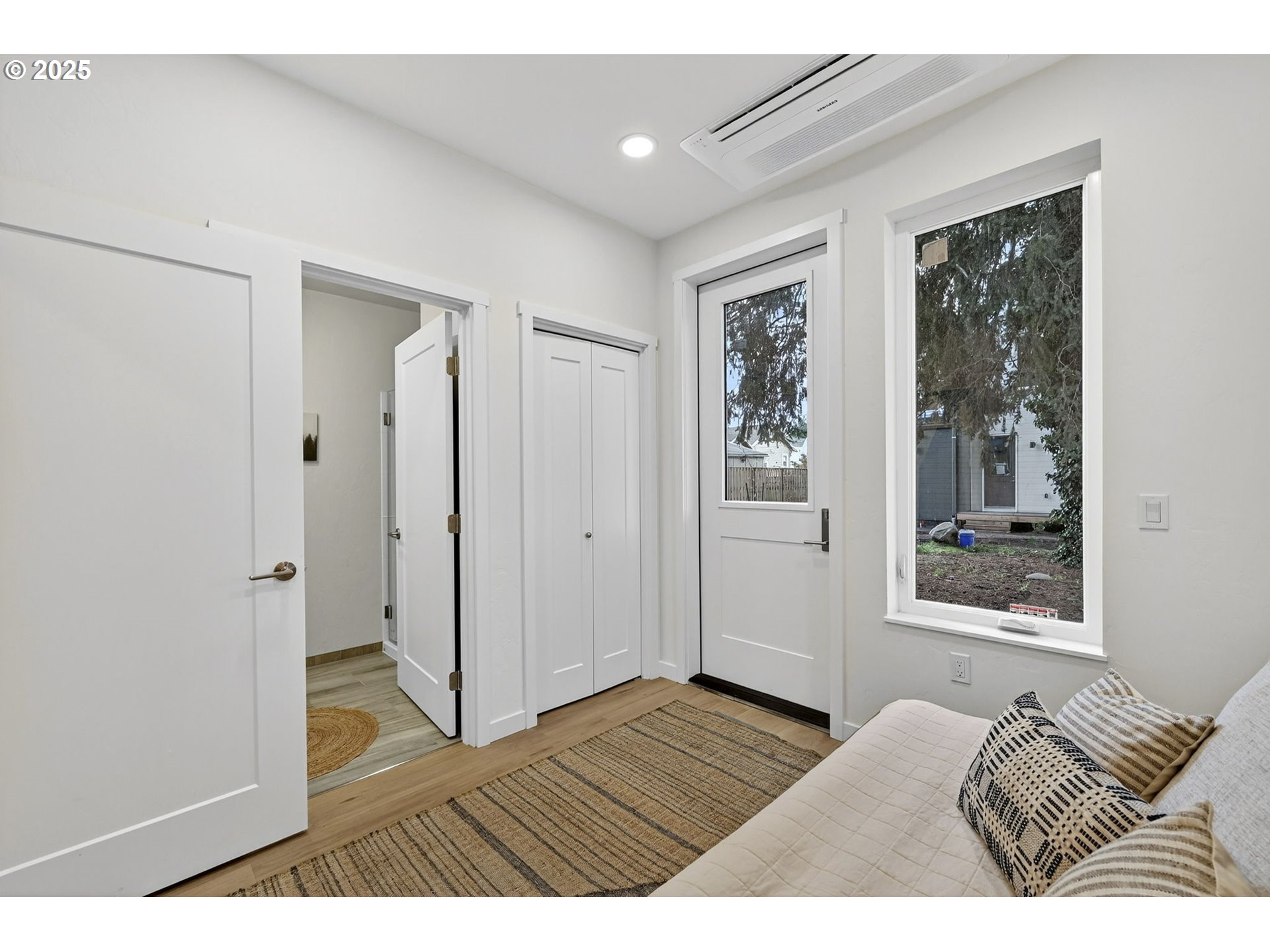 7248 Northeast Going Street Portland, OR 97218 - Photo 15 of 31 a view of bedroom with wooden floor and window