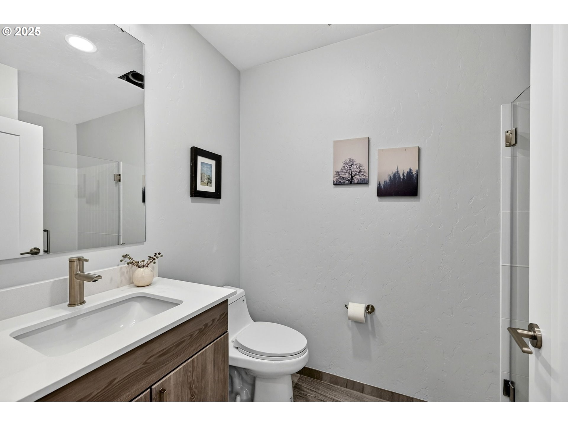 7248 Northeast Going Street Portland, OR 97218 - Photo 16 of 31 a bathroom with a sink mirror and toilet