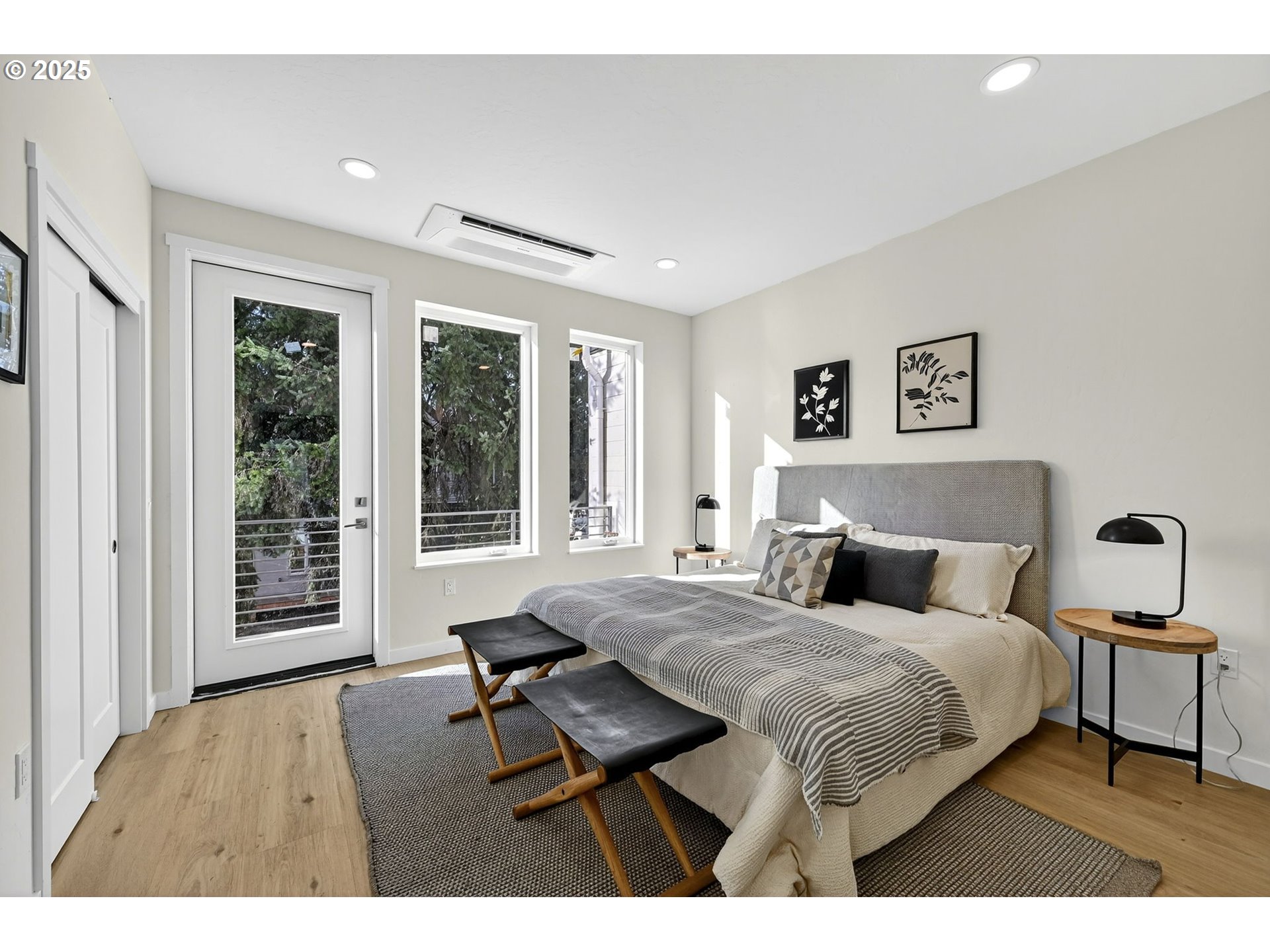 7248 Northeast Going Street Portland, OR 97218 - Photo 19 of 31 a bedroom with a bed and wooden floor