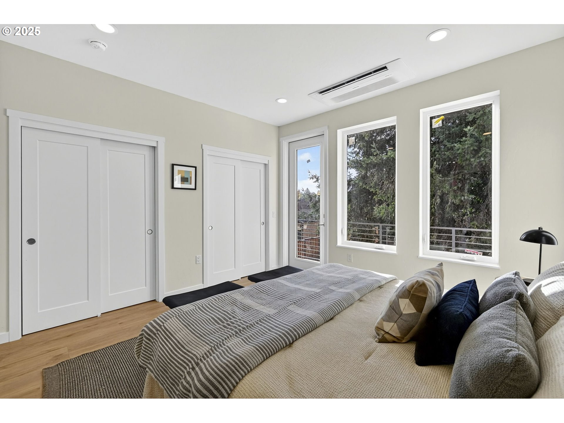7248 Northeast Going Street Portland, OR 97218 - Photo 20 of 31 a bed room with a bed a couch and a large window