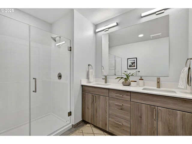 a bathroom with a double vanity sink mirror and double