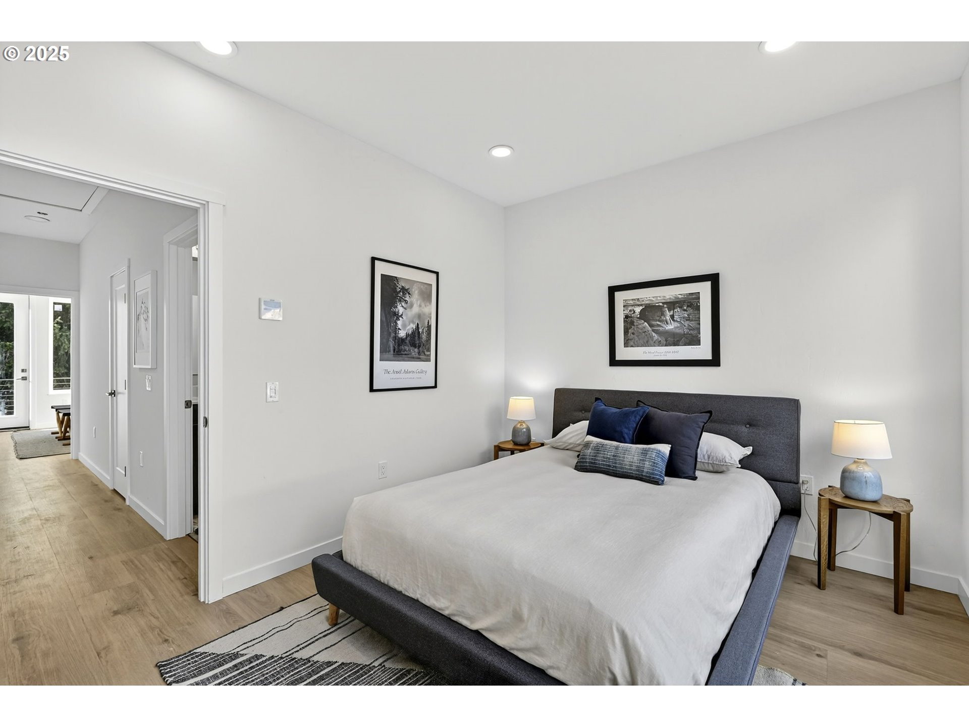 7248 Northeast Going Street Portland, OR 97218 - Photo 27 of 31 a bedroom with a bed and a painting on the wall