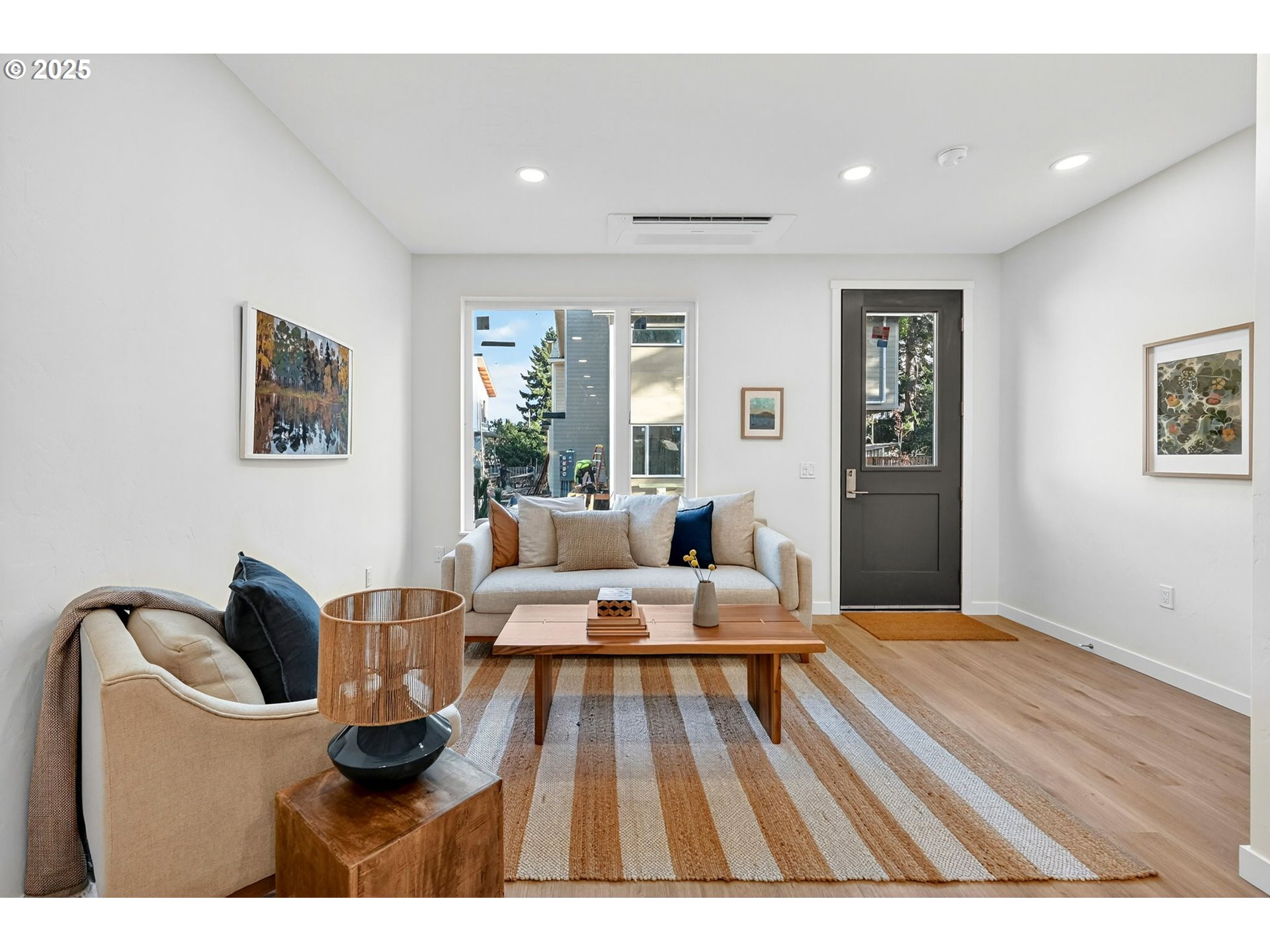 7248 Northeast Going Street Portland, OR 97218 - Photo 5 of 31 a living room with furniture and a wooden floor