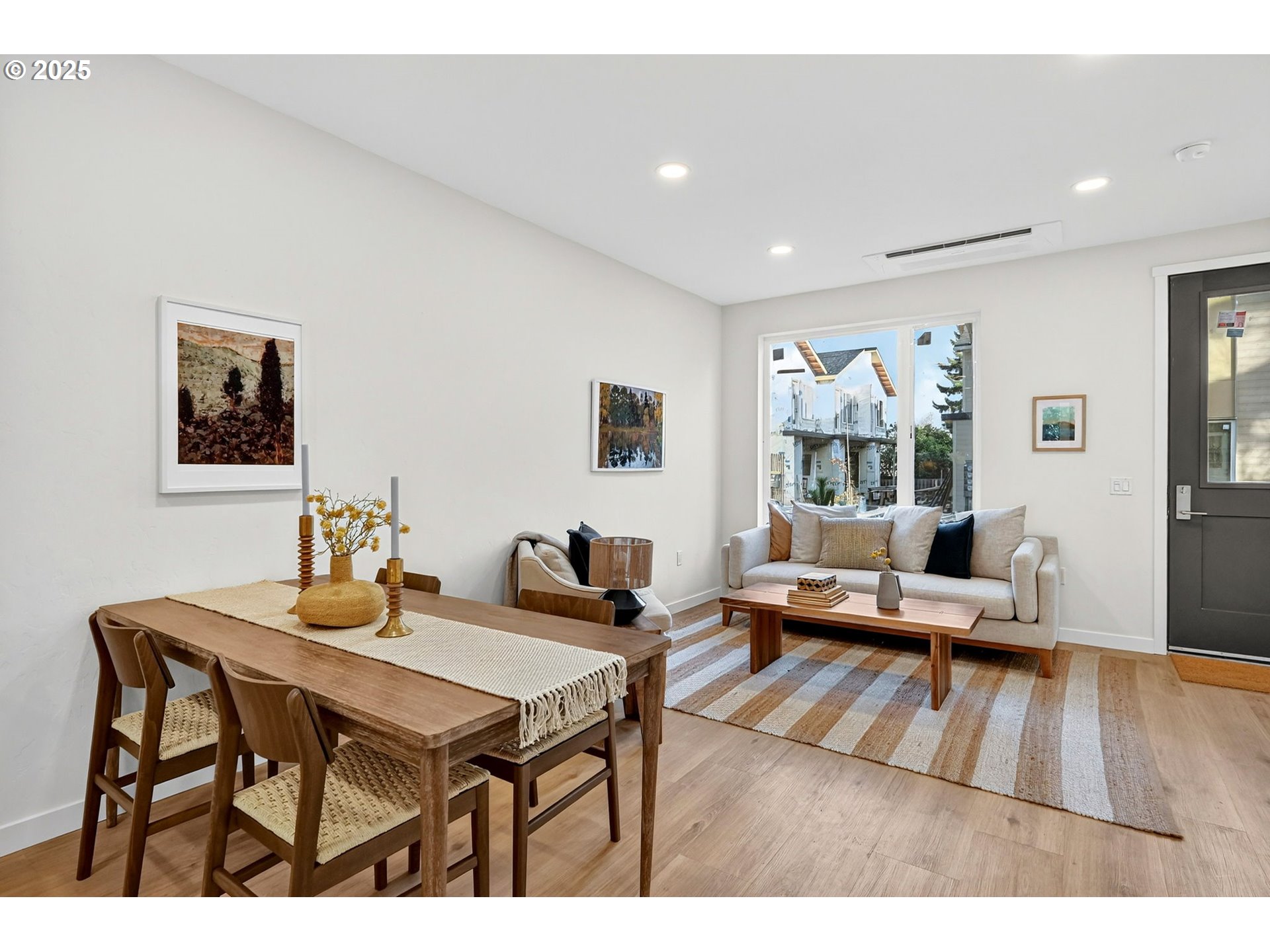 7248 Northeast Going Street Portland, OR 97218 - Photo 7 of 31 a living room with furniture and a wooden floor