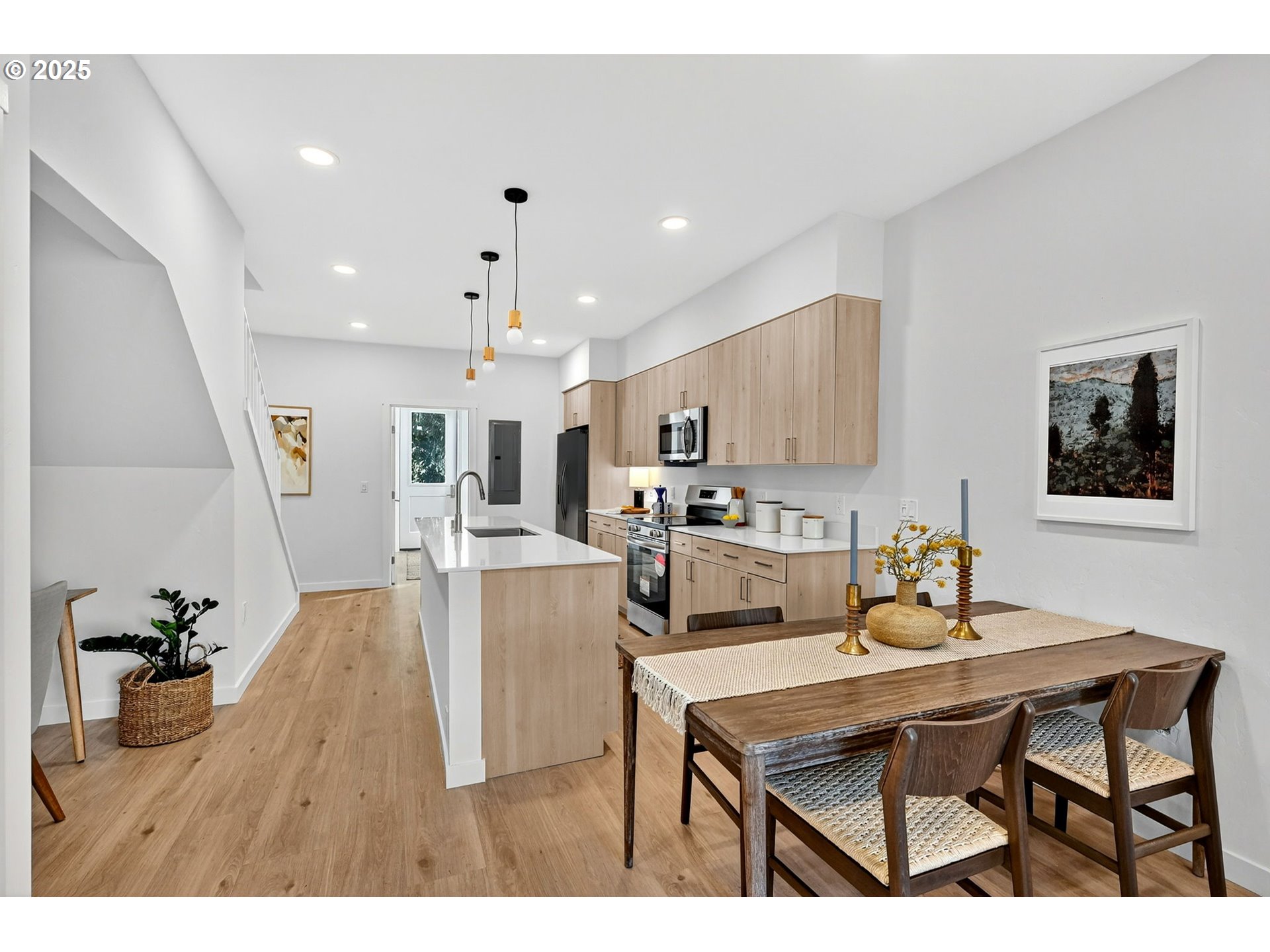 7248 Northeast Going Street Portland, OR 97218 - Photo 8 of 31 a dining hall with stainless steel appliances kitchen island granite countertop a dining table chairs and kitchen view