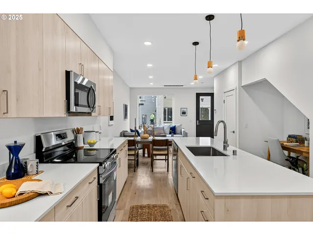 a kitchen with stainless steel appliances lots of counter top space