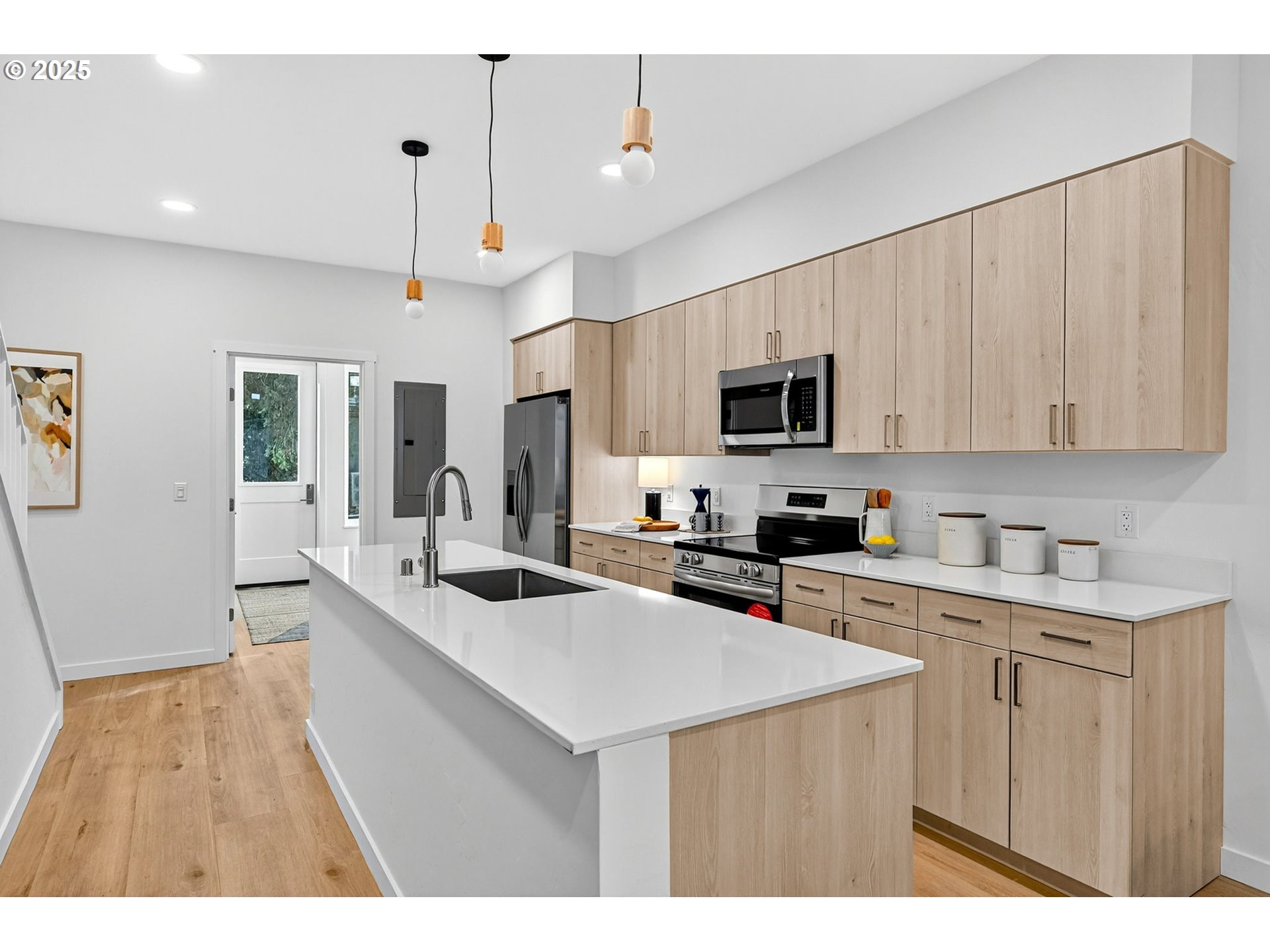 7248 Northeast Going Street Portland, OR 97218 - Photo 10 of 31 a kitchen with a sink a stove and cabinets