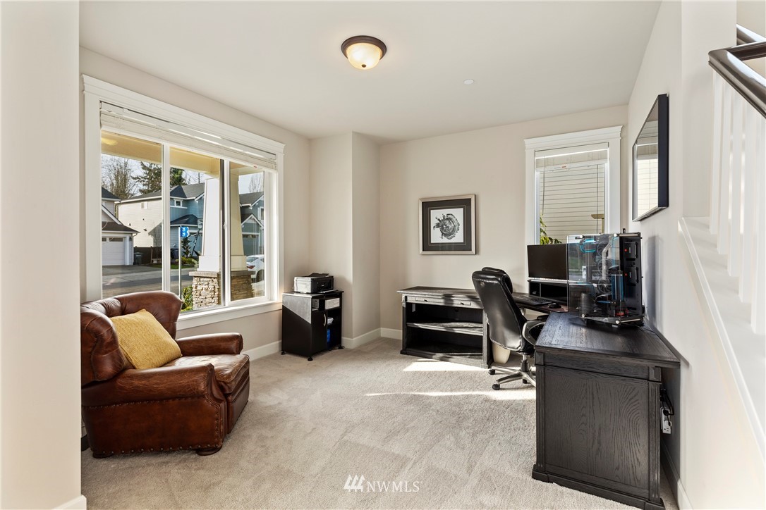 35 242nd Street Southeast Bothell, WA 98021 - Photo 14 of 29 a living room with furniture and a flat screen tv
