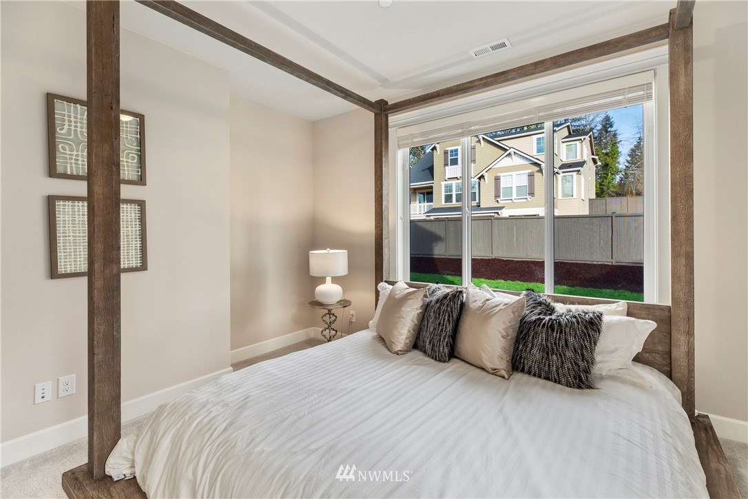 35 242nd Street Southeast Bothell, WA 98021 - Photo 16 of 29 a bed sitting in a bedroom next to a window