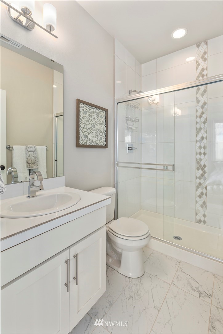 35 242nd Street Southeast Bothell, WA 98021 - Photo 17 of 29 a bathroom with a sink a toilet and shower
