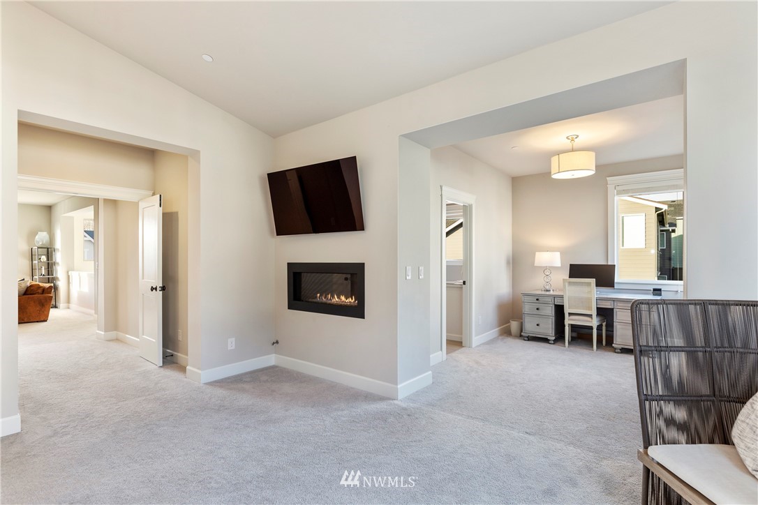 35 242nd Street Southeast Bothell, WA 98021 - Photo 19 of 29 a living room with furniture and a flat screen tv
