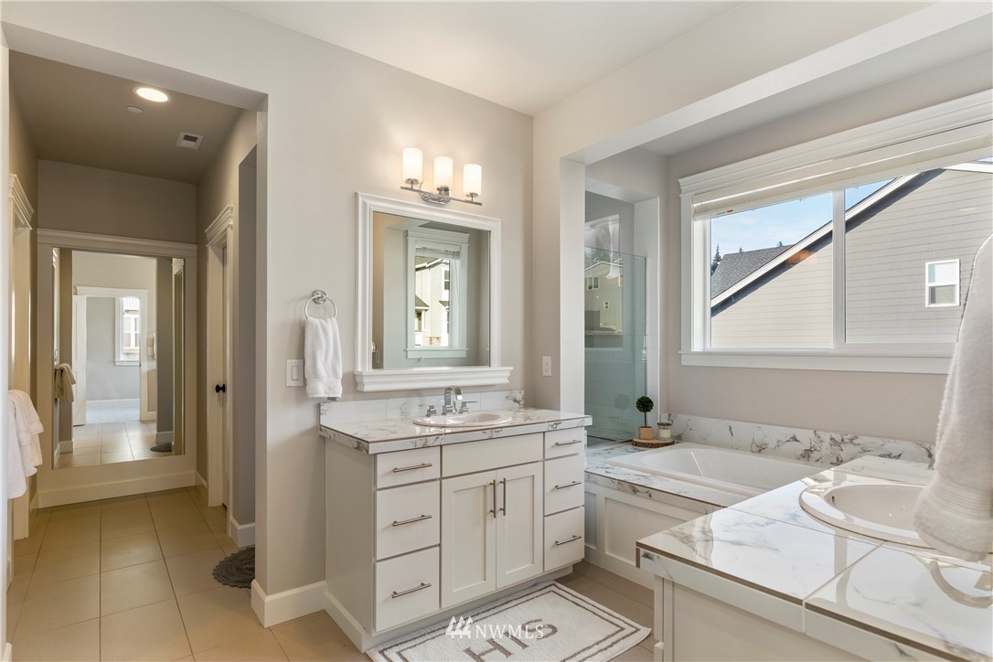 35 242nd Street Southeast Bothell, WA 98021 - Photo 21 of 29 a bathroom with a granite countertop sink mirror and double