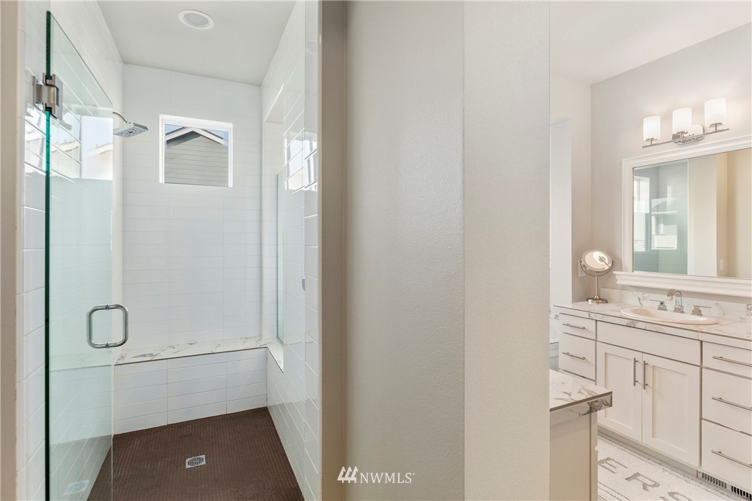 35 242nd Street Southeast Bothell, WA 98021 - Photo 22 of 29 a bathroom with a shower sink and mirror