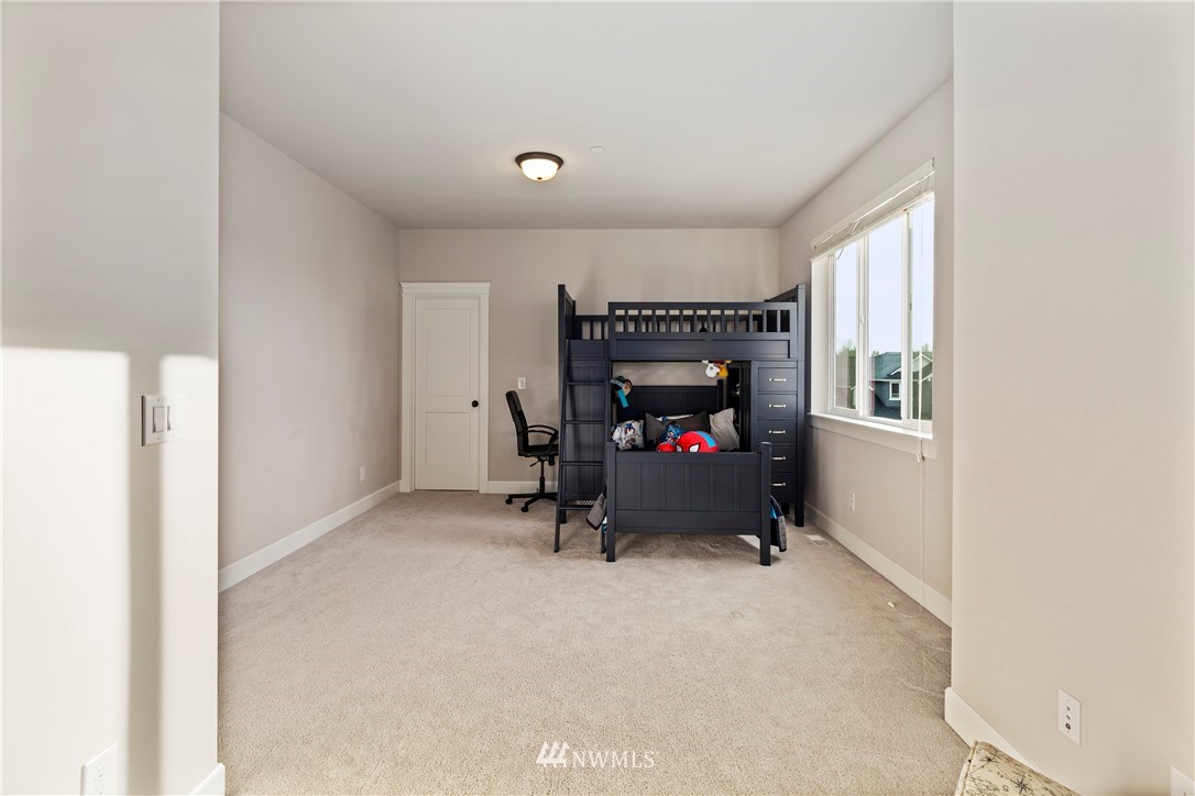35 242nd Street Southeast Bothell, WA 98021 - Photo 23 of 29 a living room with furniture and a flat screen tv