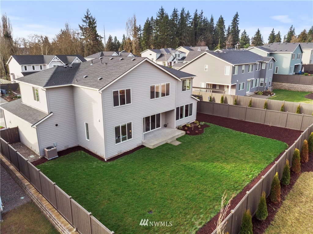 35 242nd Street Southeast Bothell, WA 98021 - Photo 29 of 29 a view of a house with a big yard and large trees