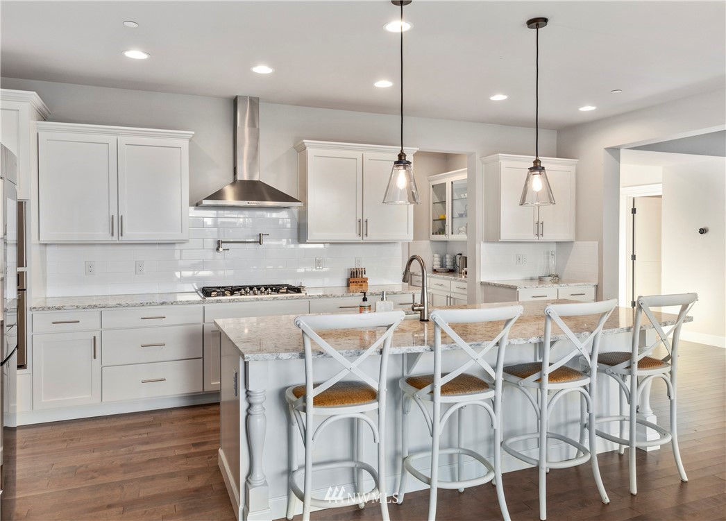 35 242nd Street Southeast Bothell, WA 98021 - Photo 7 of 29 a kitchen with cabinets and chairs
