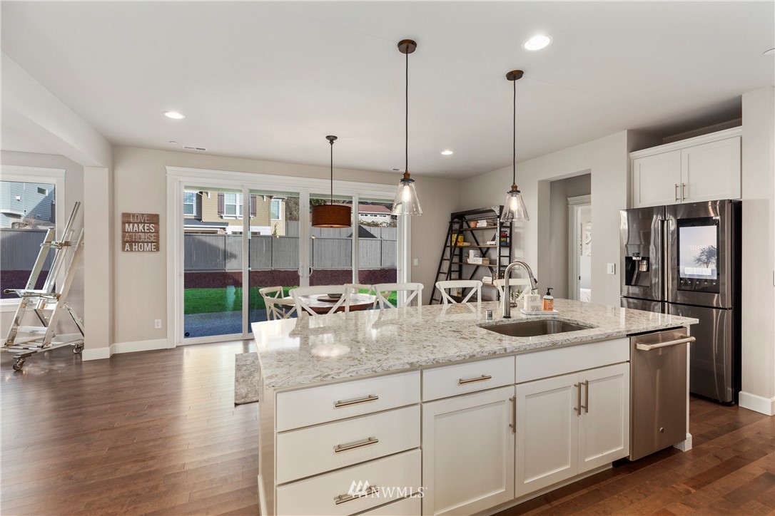 35 242nd Street Southeast Bothell, WA 98021 - Photo 9 of 29 a kitchen with counter top space and wooden floor