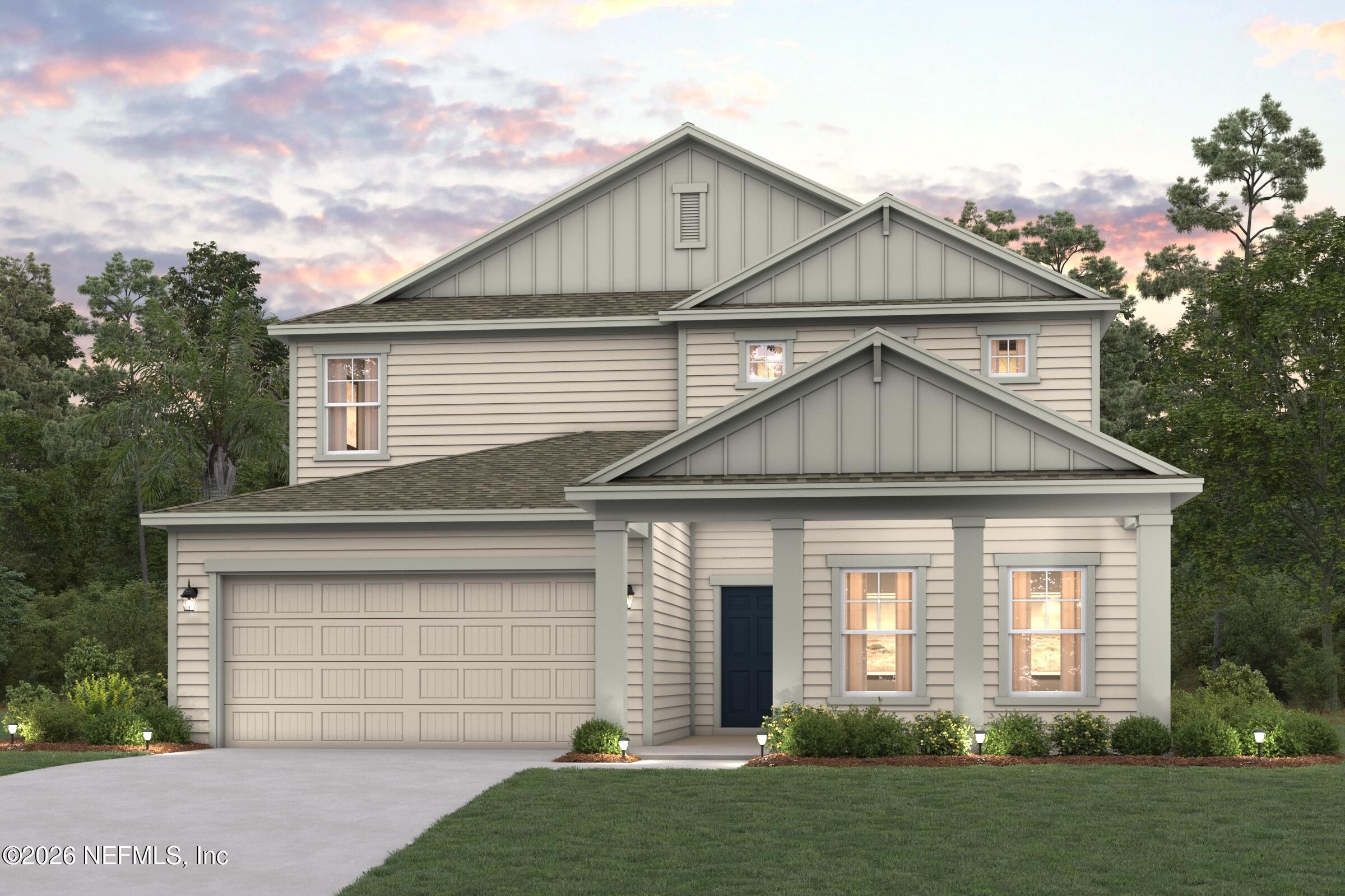 1332 Ribbon Place Palm Coast, FL 32164 - Photo 2 of 11 a front view of a house with a garden and plants