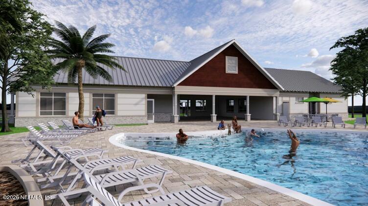 1332 Ribbon Place Palm Coast, FL 32164 - Photo 9 of 11 a front view of a house with sitting area and furniture