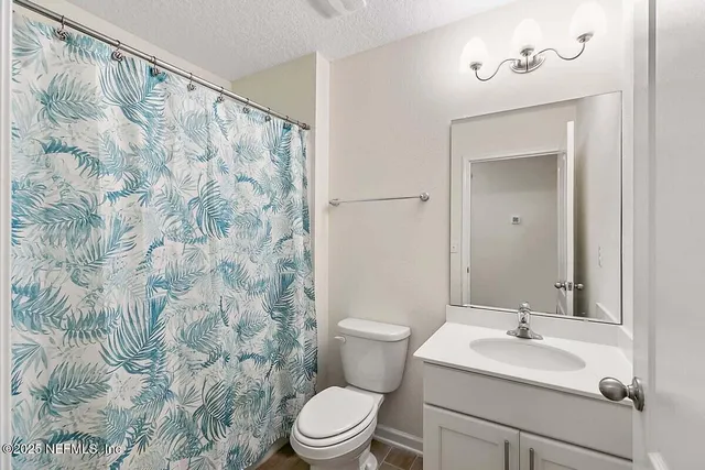 a kitchen with stainless steel appliances a refrigerator stove microwave and cabinets