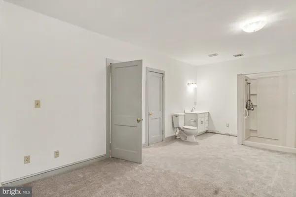 a big room with closet and windows