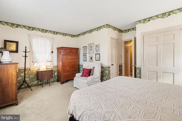 a bedroom with a bed and furniture