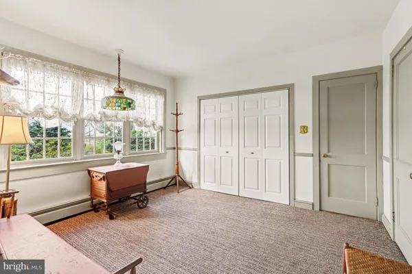 a view of workspace with wooden floor and furniture