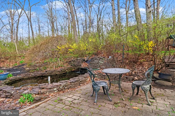 a view of an outdoor space with a table and chairs