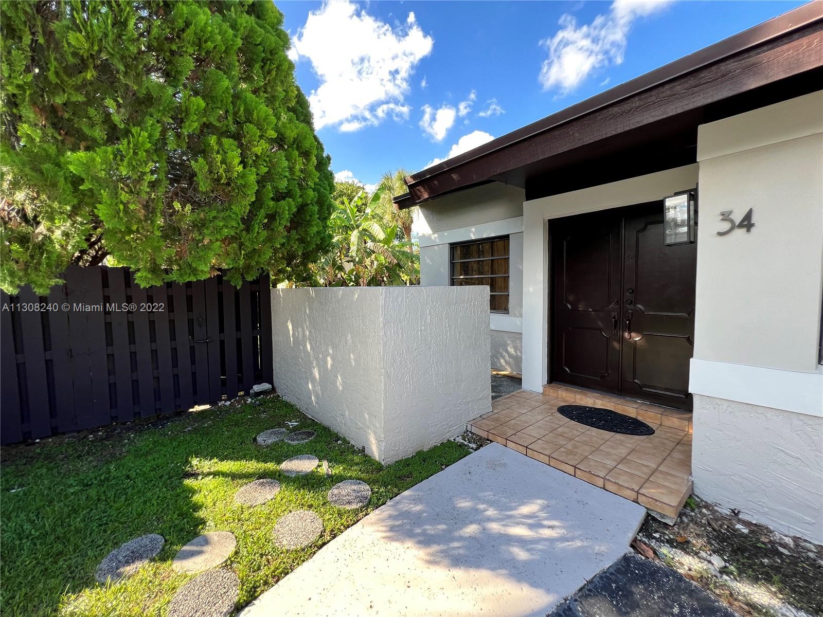 9630 Southwest 152nd Avenue, Unit 34 Miami, FL 33196 - Photo 2 of 13 a view of backyard with tub