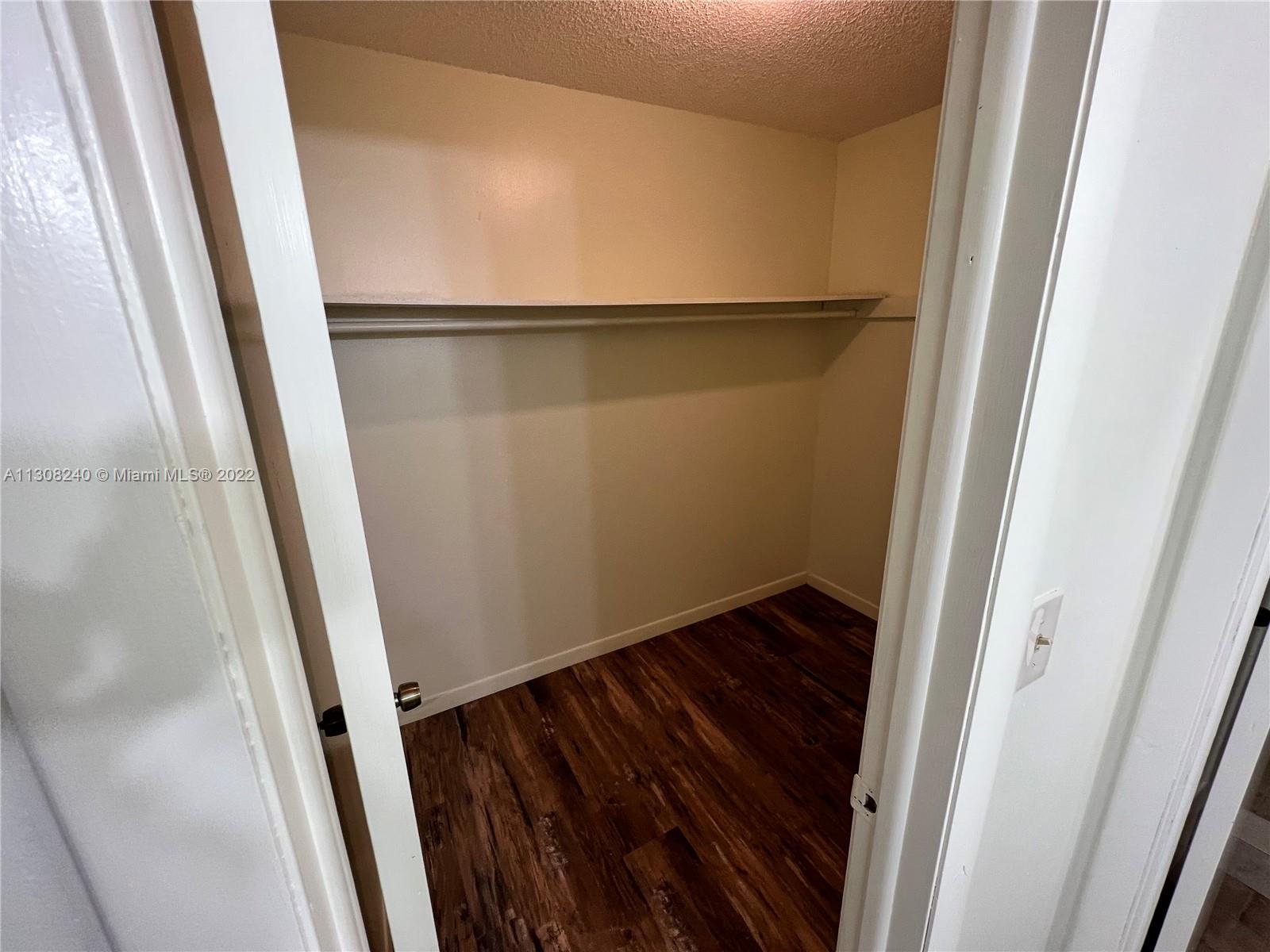 9630 Southwest 152nd Avenue, Unit 34 Miami, FL 33196 - Photo 6 of 13 a view of wooden floor