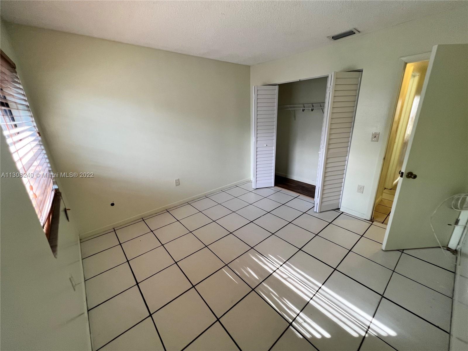 9630 Southwest 152nd Avenue, Unit 34 Miami, FL 33196 - Photo 9 of 13 a view of an empty room