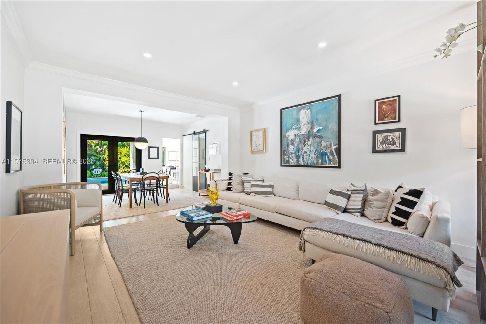 740 Northeast 76th Street Miami, FL 33138 - Photo 13 of 43 a living room with furniture and a large window