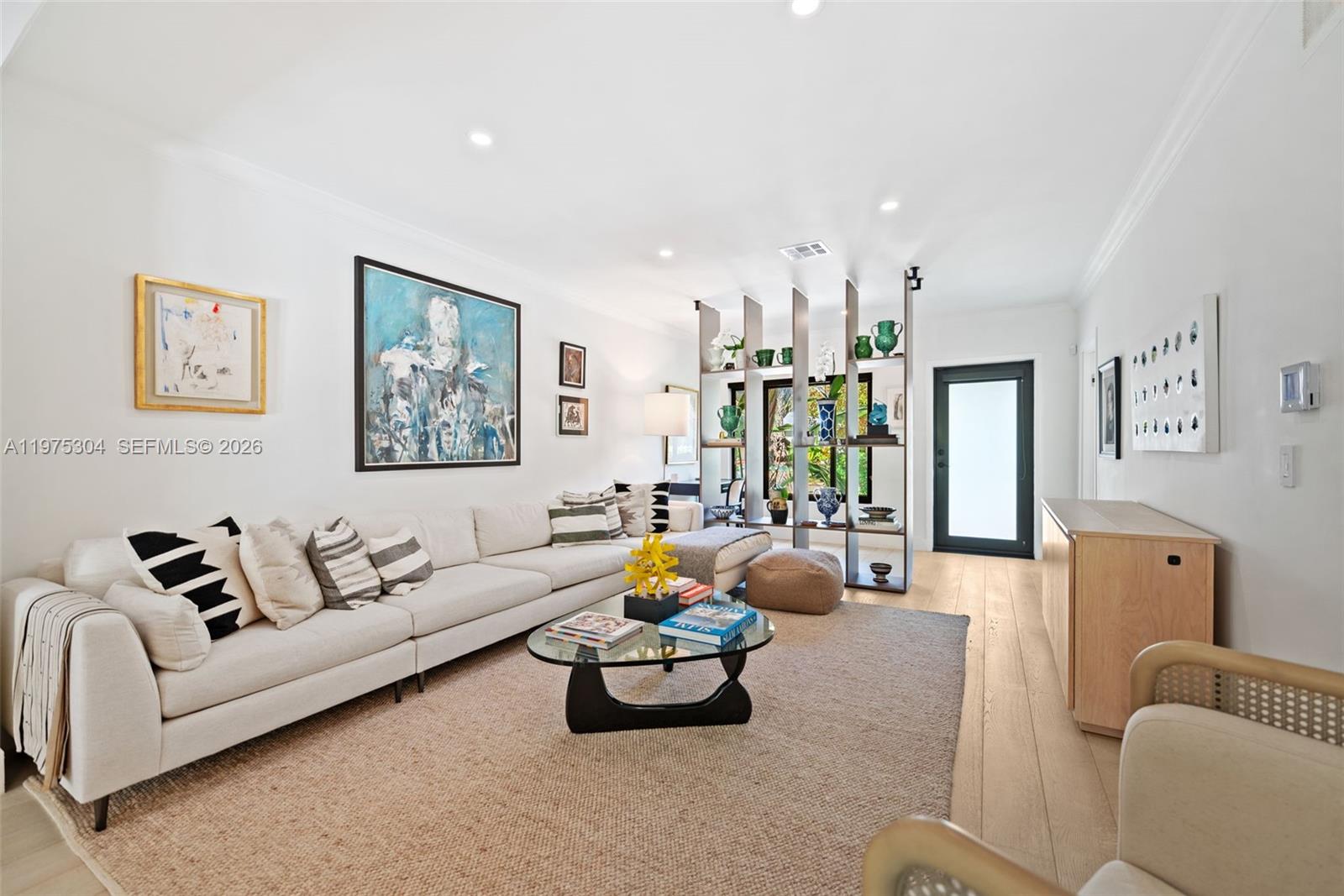 740 Northeast 76th Street Miami, FL 33138 - Photo 14 of 43 a living room with furniture and a large window