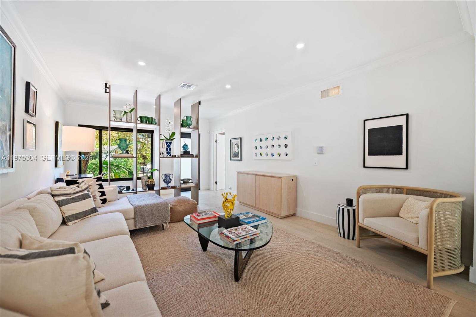 740 Northeast 76th Street Miami, FL 33138 - Photo 15 of 43 a living room with furniture and a large window