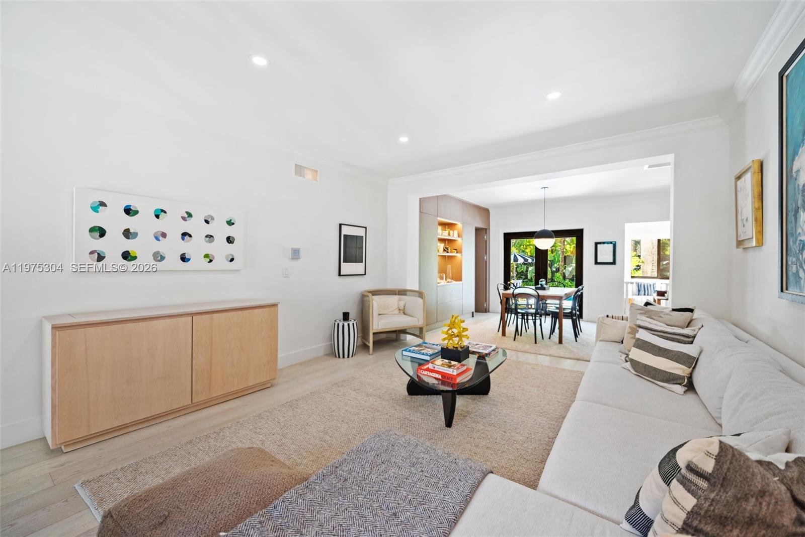740 Northeast 76th Street Miami, FL 33138 - Photo 16 of 43 a living room with furniture and a dining area