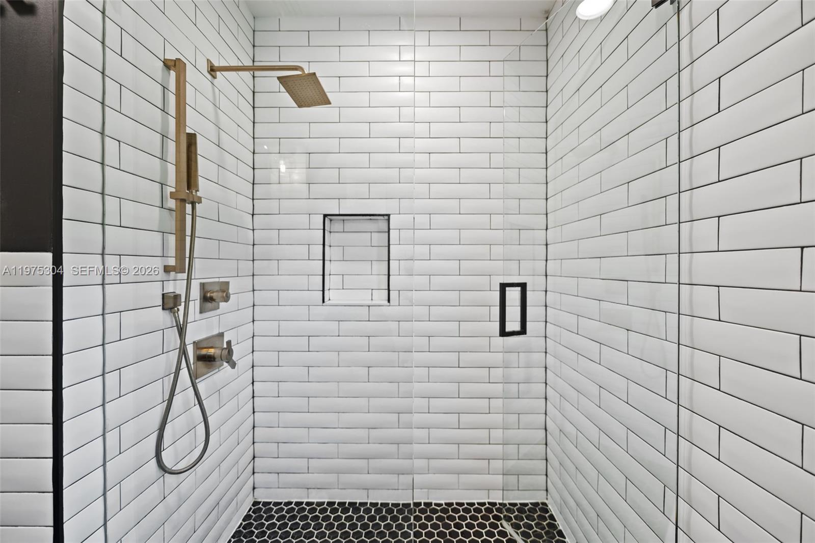 740 Northeast 76th Street Miami, FL 33138 - Photo 22 of 43 a bathroom with a shower