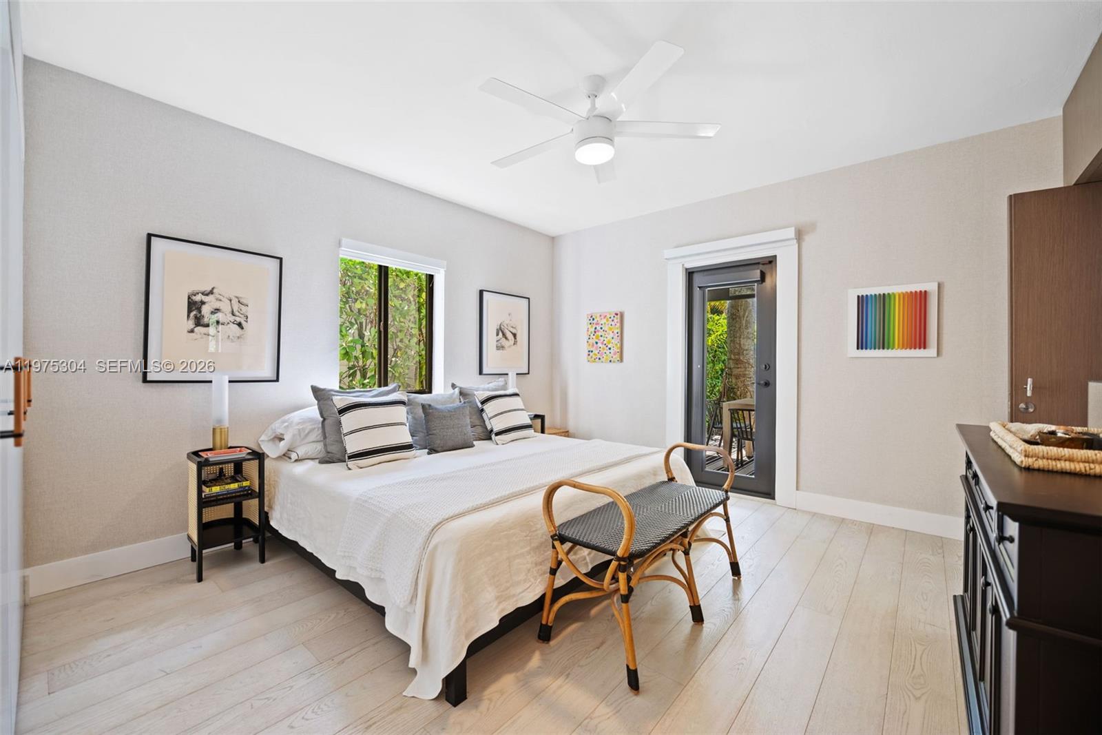 740 Northeast 76th Street Miami, FL 33138 - Photo 24 of 43 a bedroom with a bed and a table in it