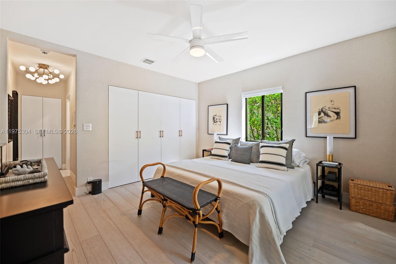 740 Northeast 76th Street Miami, FL 33138 - Photo 26 of 43 a bedroom with a bed and a table in it