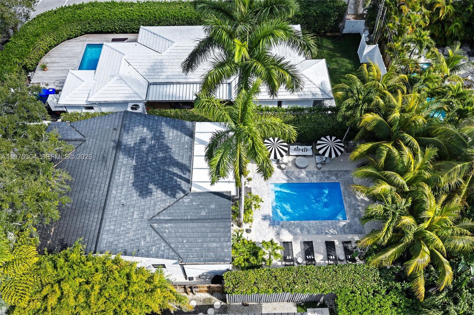 740 Northeast 76th Street Miami, FL 33138 - Photo 36 of 43 an aerial view of a house with a yard and garden