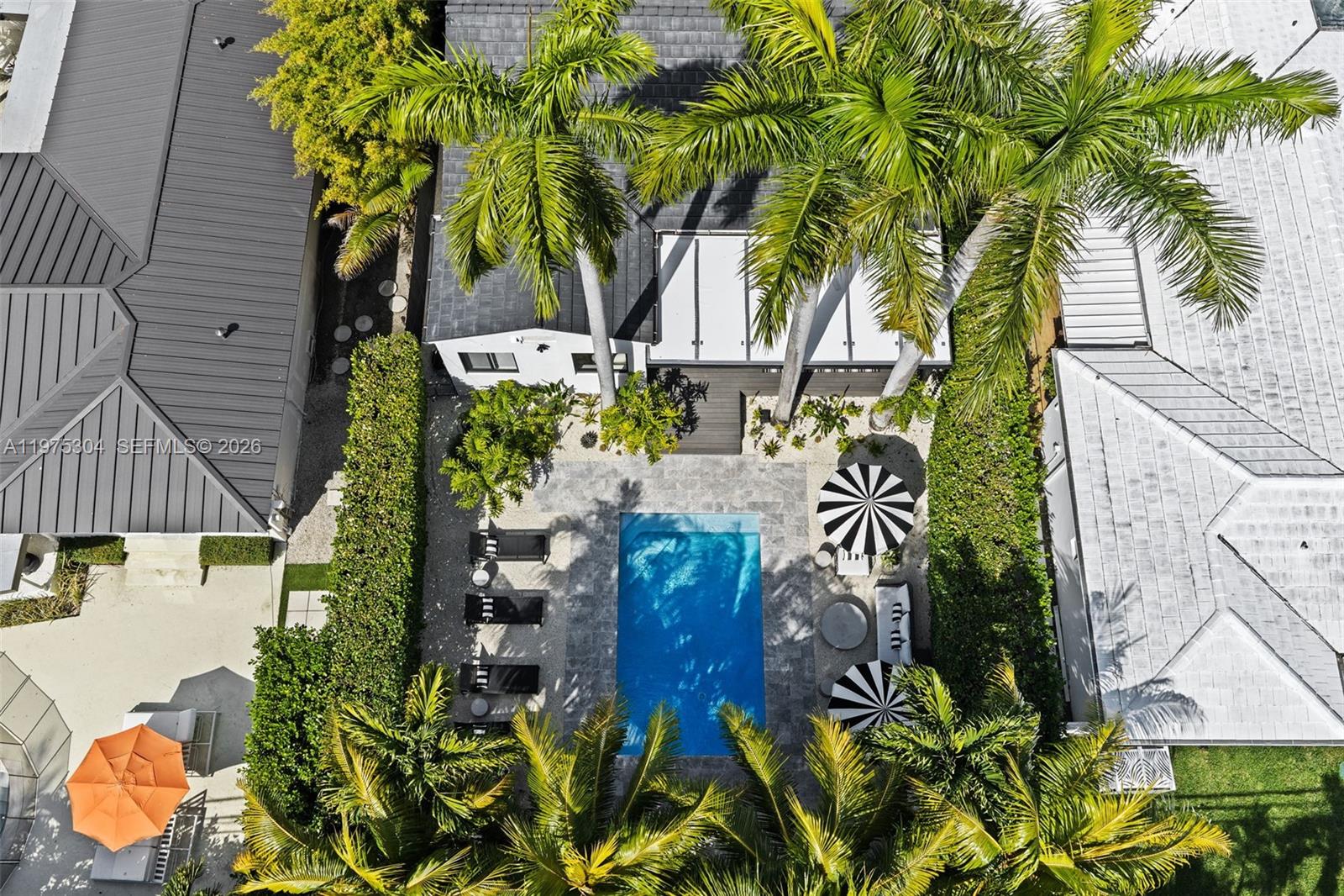 740 Northeast 76th Street Miami, FL 33138 - Photo 38 of 43 a view of a house with a garden