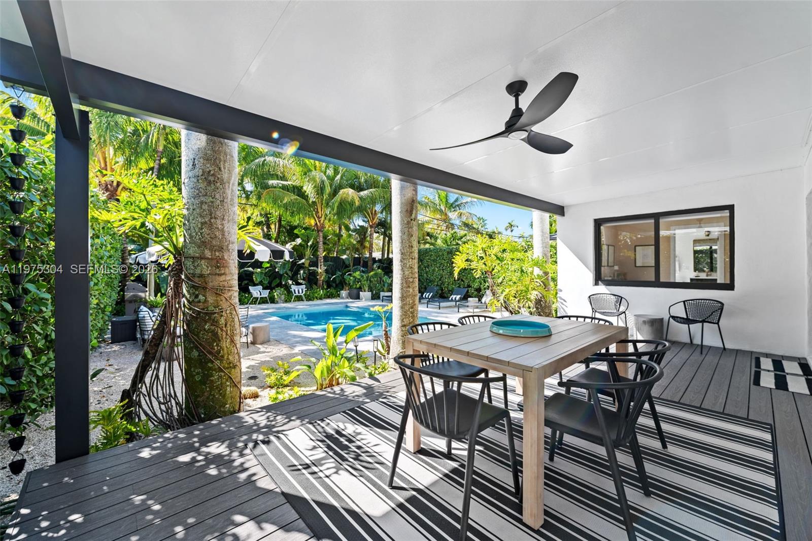 740 Northeast 76th Street Miami, FL 33138 - Photo 7 of 43 a view of a dining room with furniture window and outside view