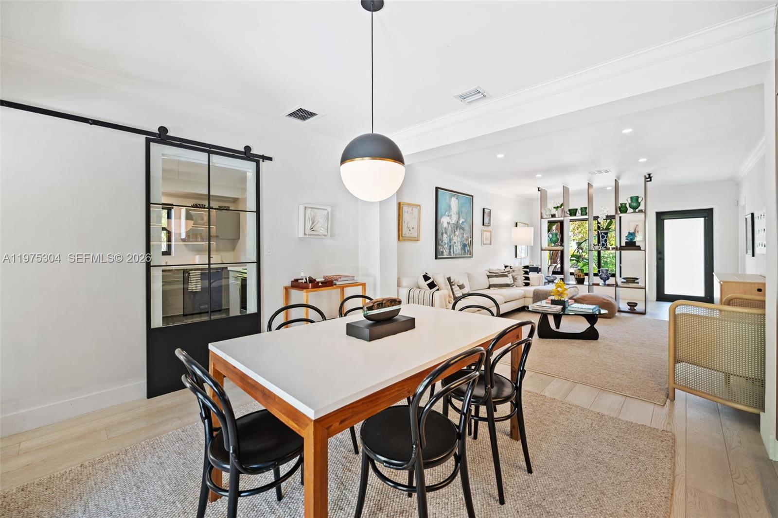 740 Northeast 76th Street Miami, FL 33138 - Photo 9 of 43 a view of a dining room and livingroom with furniture